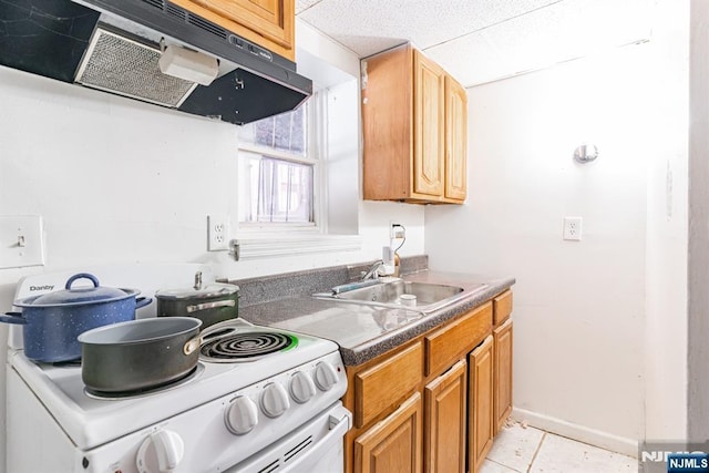 kitchen with sink, white electric range, and light tile patterned floors