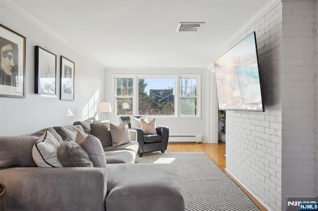 living room featuring crown molding, light wood finished floors, a baseboard radiator, visible vents, and brick wall