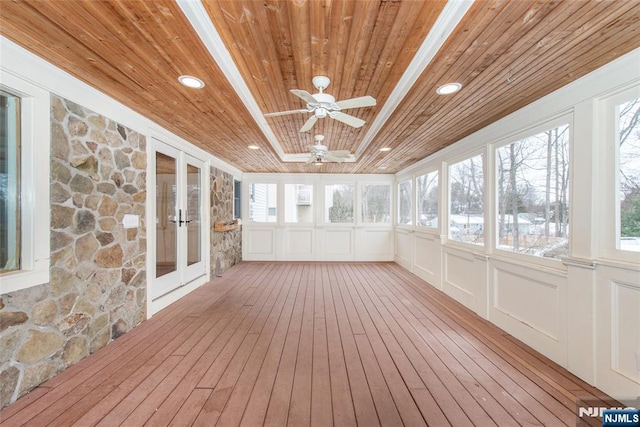 unfurnished sunroom featuring wooden ceiling, french doors, and ceiling fan