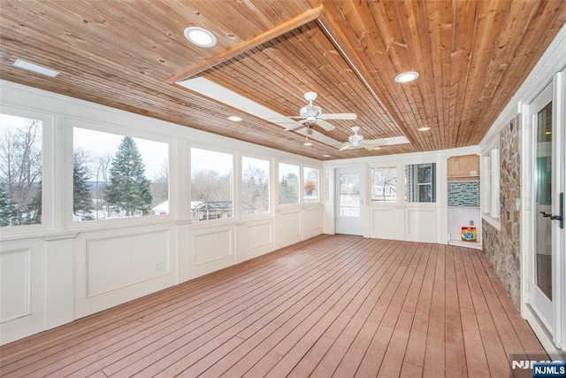 unfurnished sunroom with wooden ceiling