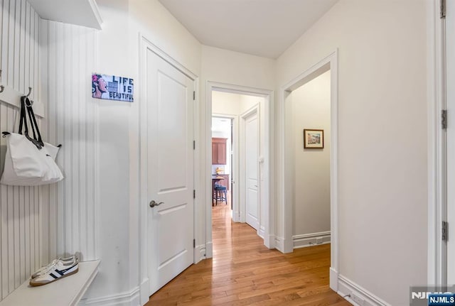 corridor featuring light hardwood / wood-style floors