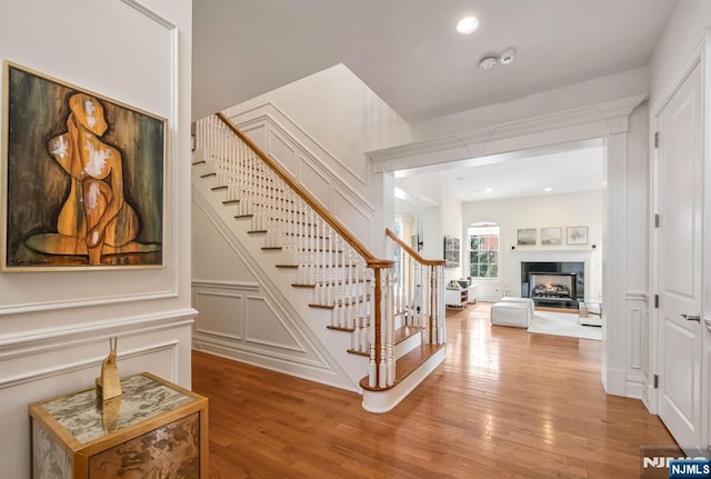 staircase with wood-type flooring