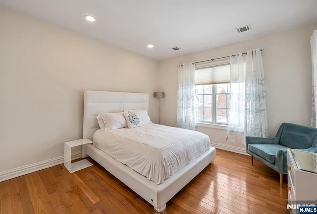 bedroom with wood-type flooring