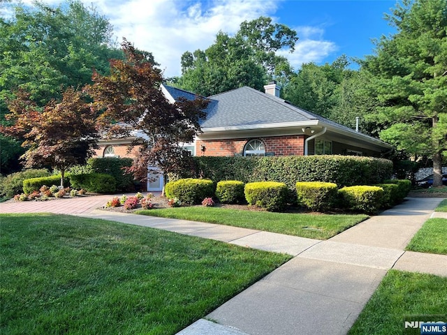 view of home's exterior featuring a yard