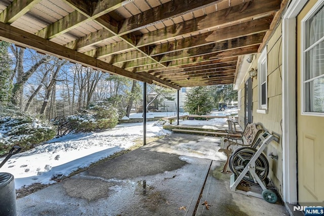 view of snow covered patio