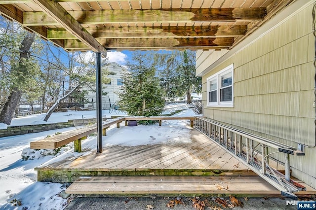 view of snow covered deck