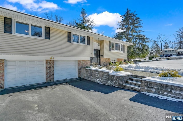 raised ranch featuring a garage