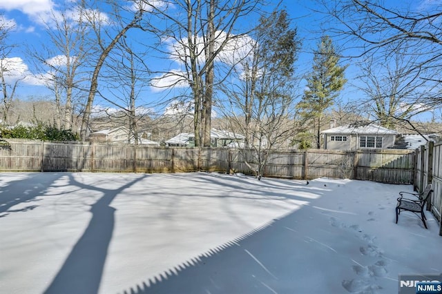 view of yard covered in snow