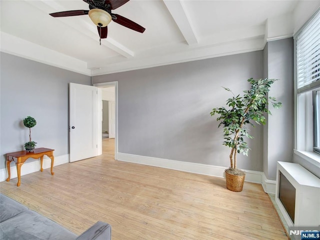 sitting room featuring ceiling fan, beam ceiling, and light hardwood / wood-style flooring