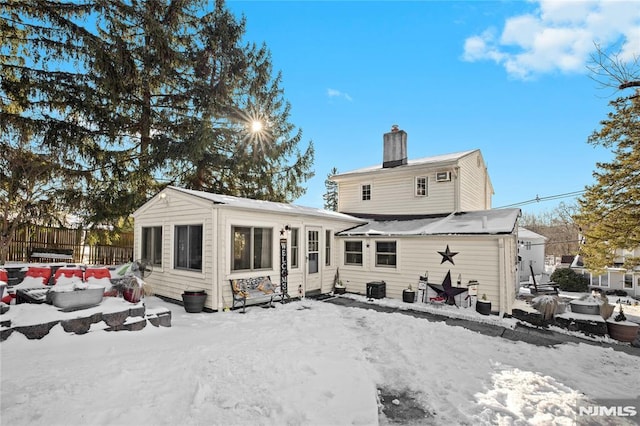 view of snow covered house