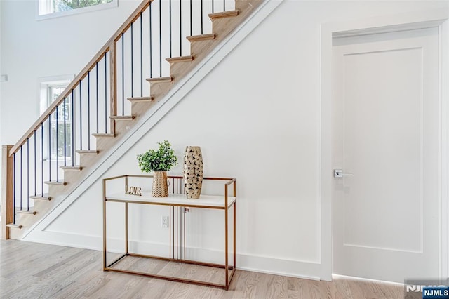 staircase with wood-type flooring