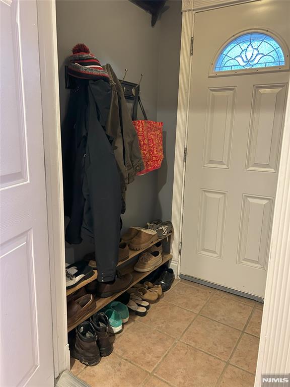 mudroom featuring light tile patterned flooring