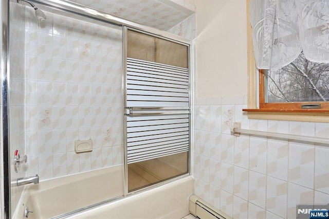 bathroom with radiator heating unit, bath / shower combo with glass door, and tile walls