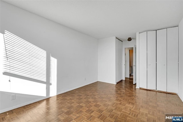 unfurnished bedroom featuring baseboards