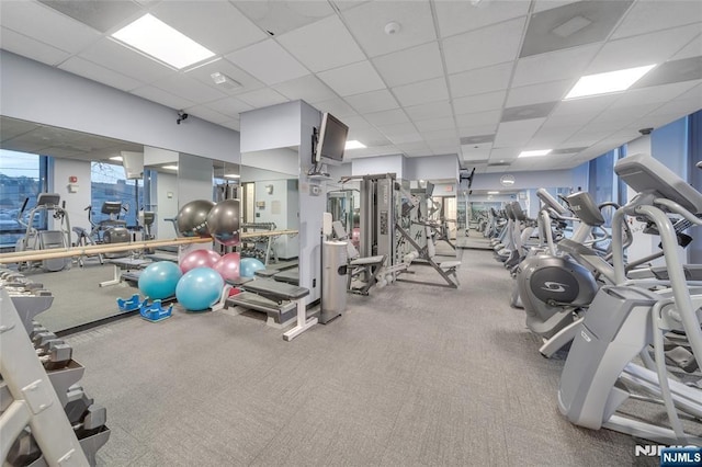 gym featuring visible vents and a drop ceiling