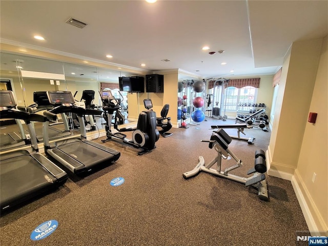 workout area with crown molding