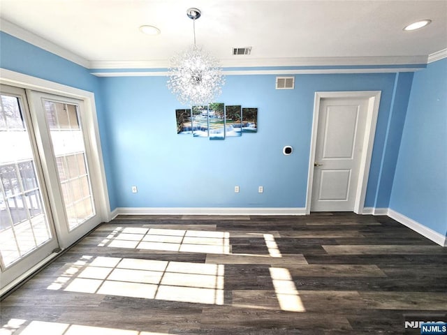 unfurnished dining area with dark wood-type flooring, ornamental molding, and plenty of natural light