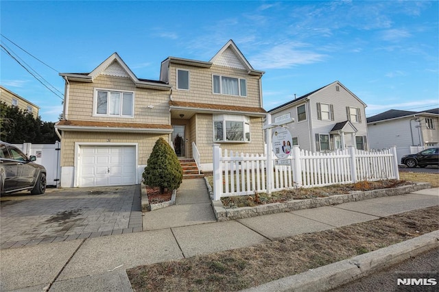 view of front of property with a garage