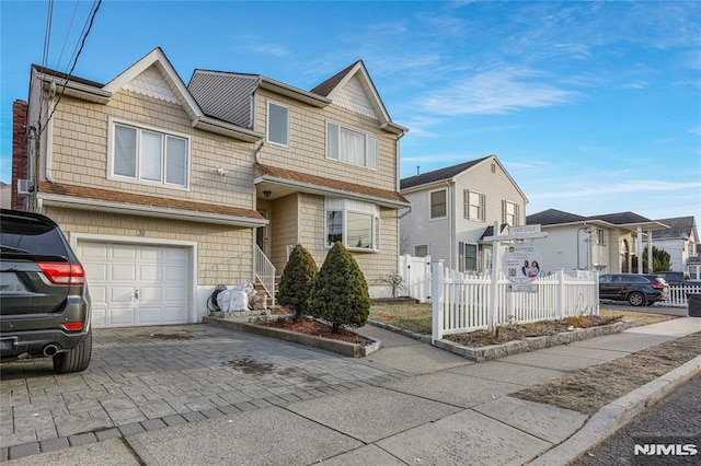 view of front of home with a garage