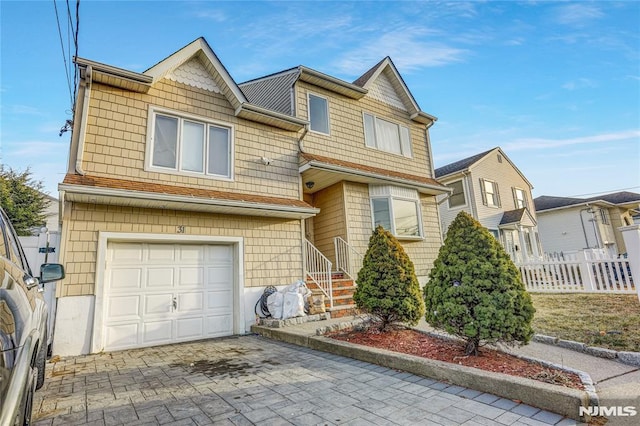 view of front of home with a garage