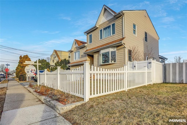 view of property exterior featuring a yard