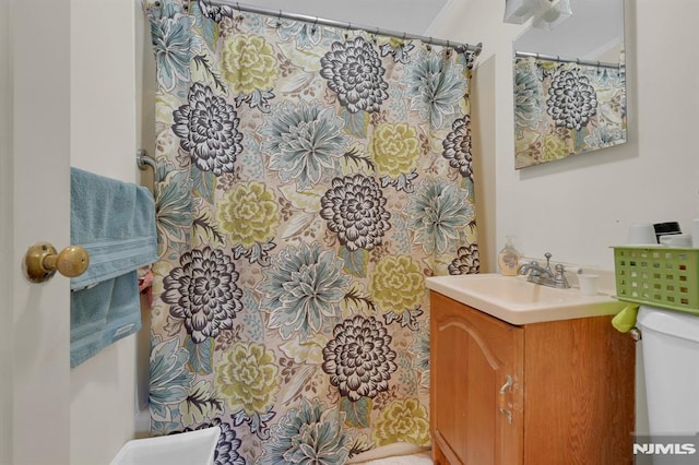 bathroom with vanity and toilet