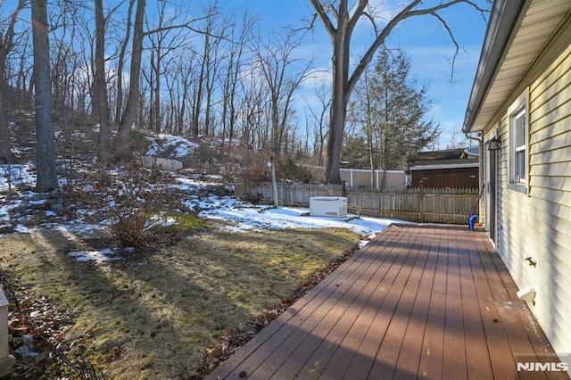 snow covered deck with fence