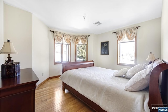 bedroom with light hardwood / wood-style flooring