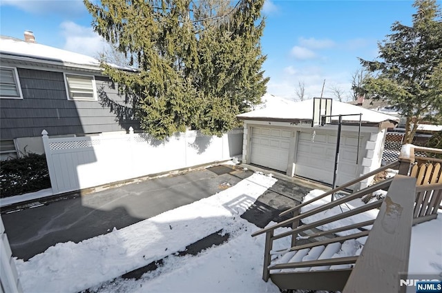 exterior space with an outbuilding and a garage