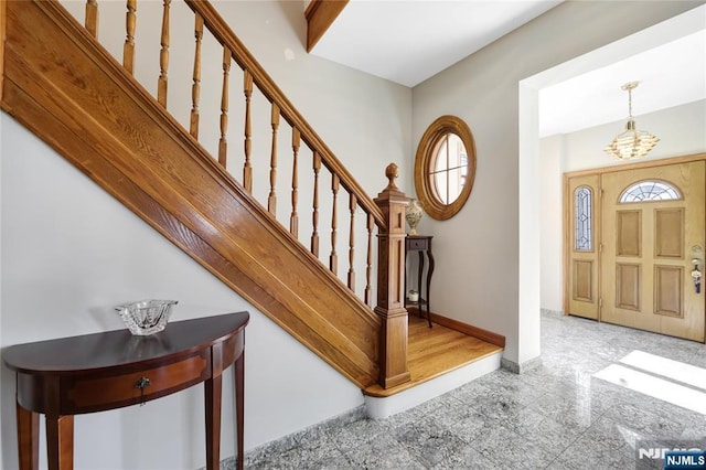 entrance foyer with a chandelier