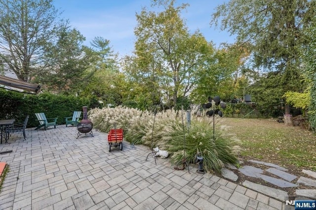 view of patio / terrace with a fire pit