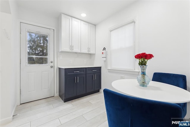 kitchen featuring white cabinets