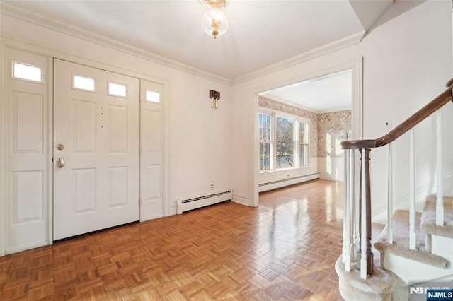 foyer featuring stairs, baseboard heating, and ornamental molding