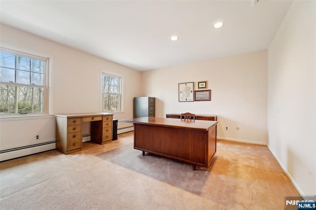 office area with a baseboard heating unit, recessed lighting, light colored carpet, and baseboards