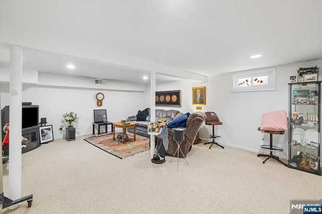 living area with recessed lighting, visible vents, and light colored carpet