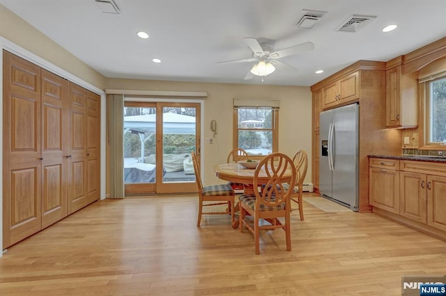 dining room featuring light wood finished floors, visible vents, a ceiling fan, and recessed lighting