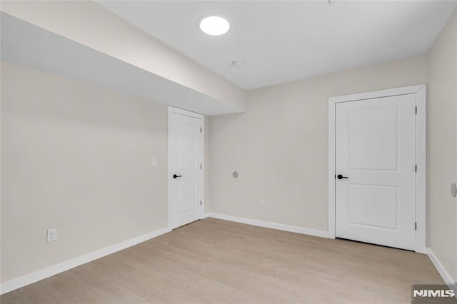 unfurnished room featuring light hardwood / wood-style flooring