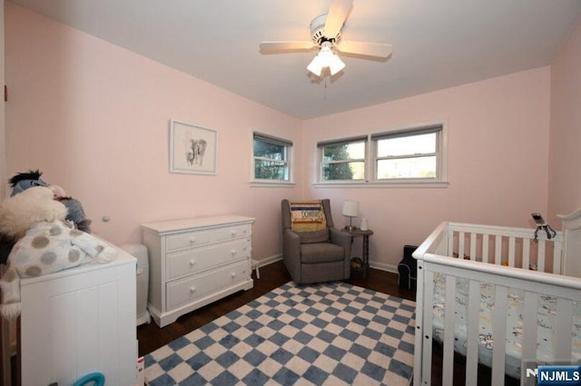 bedroom featuring ceiling fan and baseboards