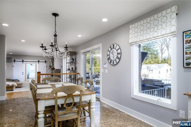 dining area featuring recessed lighting, an inviting chandelier, baseboards, and a barn door