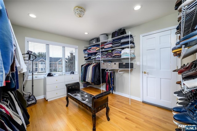 walk in closet featuring light wood-style flooring