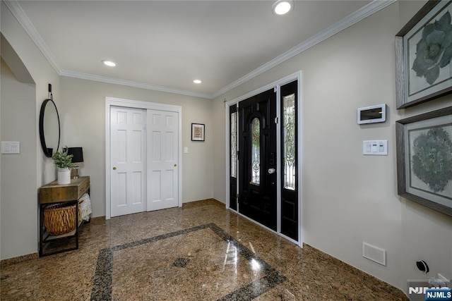 entryway featuring granite finish floor, ornamental molding, and recessed lighting