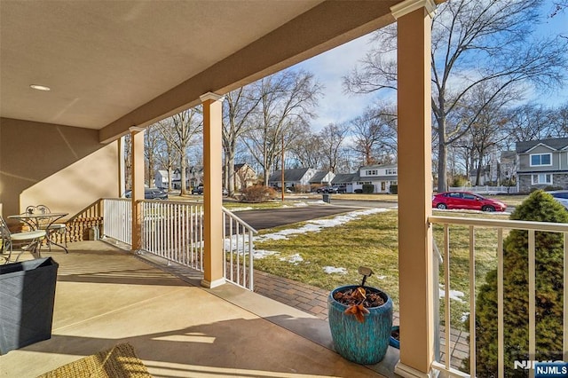 balcony featuring a porch and a residential view