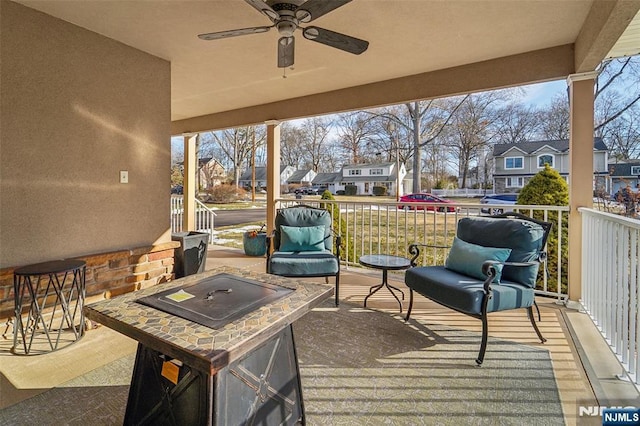 exterior space featuring ceiling fan and a residential view