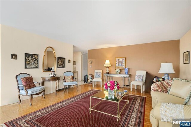 living room featuring parquet flooring