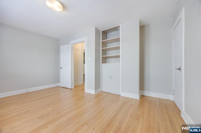 unfurnished bedroom with light wood-type flooring