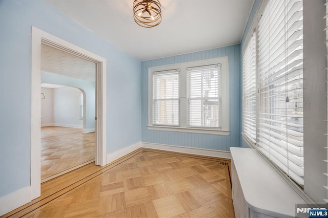 spare room featuring light parquet flooring