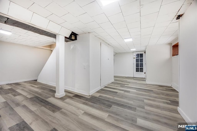 basement featuring light wood-type flooring