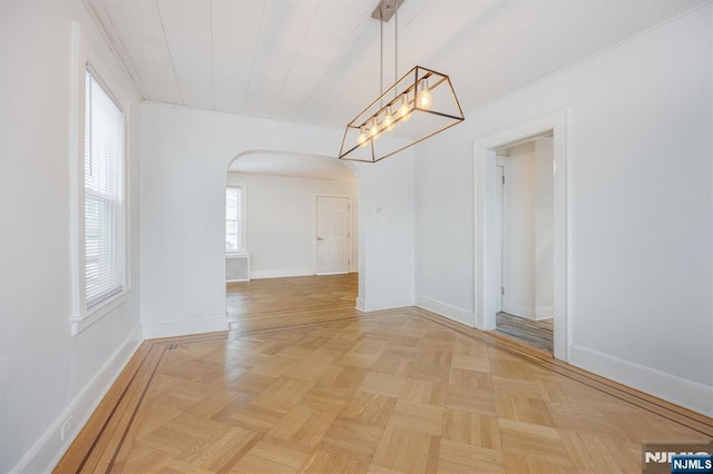 unfurnished dining area featuring light parquet flooring