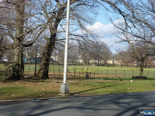 view of property's community with a yard