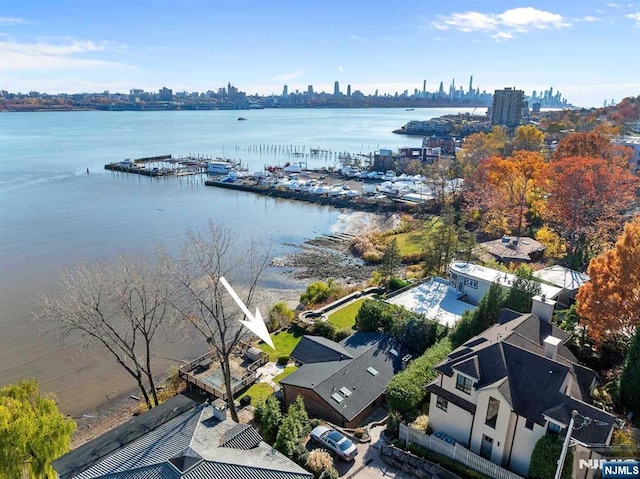 birds eye view of property featuring a water view